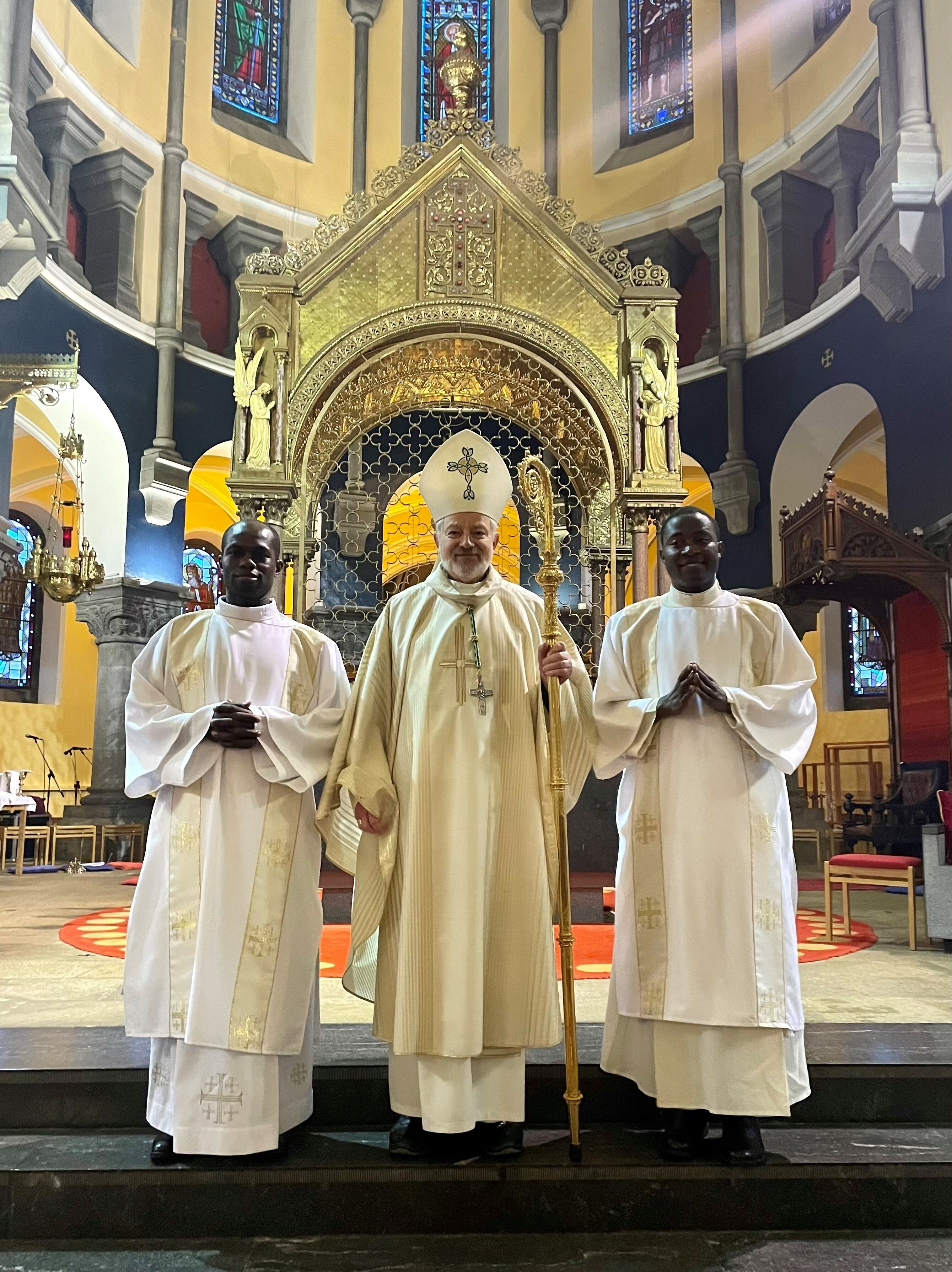 Bishop-Kevin-Doran-with-Deacon-Conrad-Forzeh-left-and-Deacon-Frankline-Nkopi-right-06-01-23.jpg#asset:11423